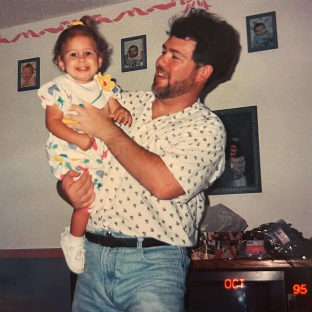 A real photo of the author sometime after a full recovery with one of his daughters.